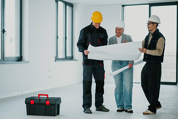 Verified tradespeople reviewing plans with a customer
